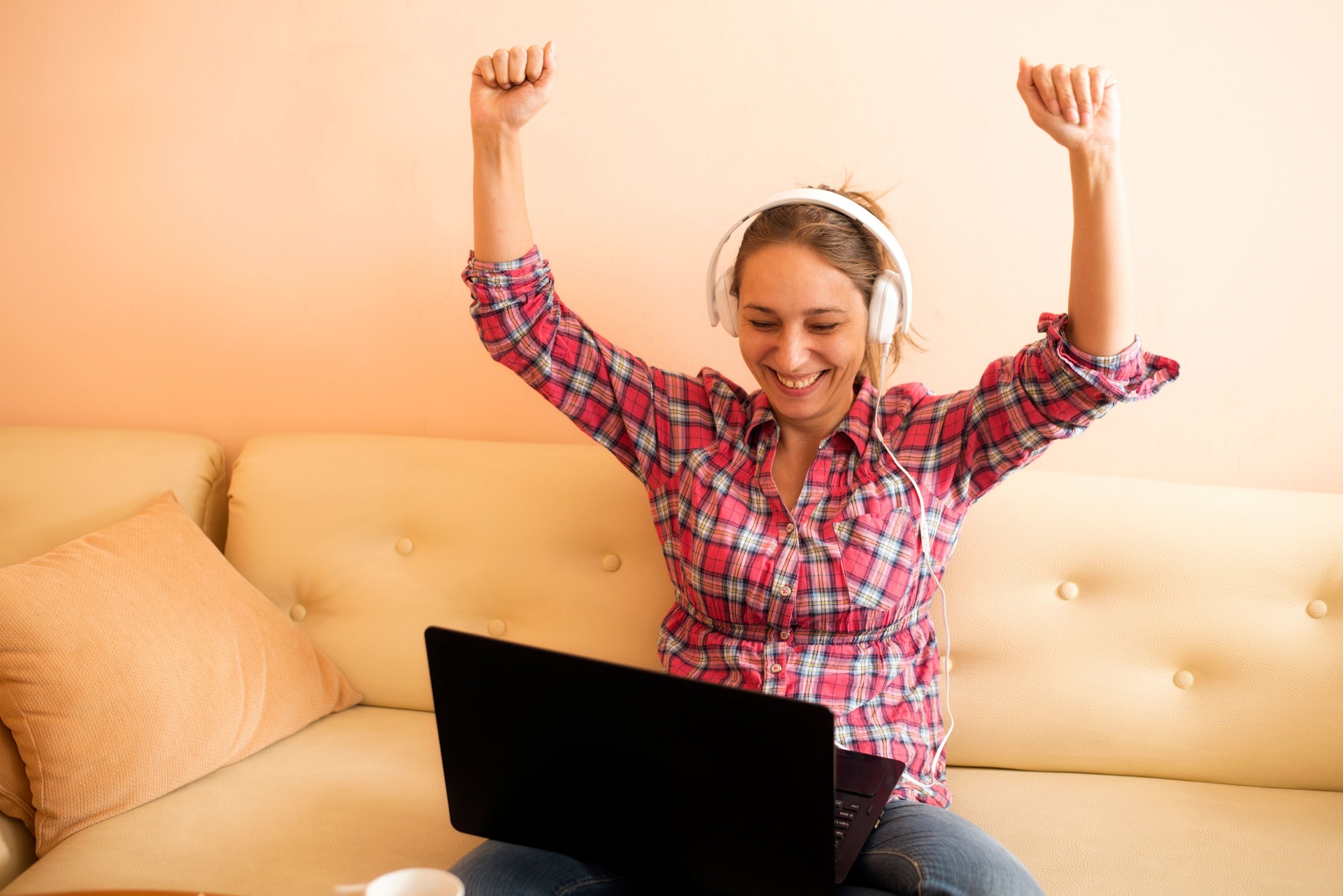 Happy Euphoric Winner watching a laptop